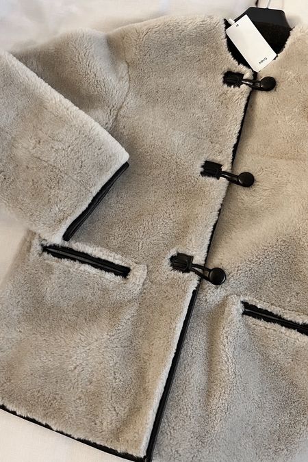 Fur-effect coat with appliqués, beige black contrasting trims leather lined 

#LTKSeasonal #LTKsalealert #LTKstyletip
