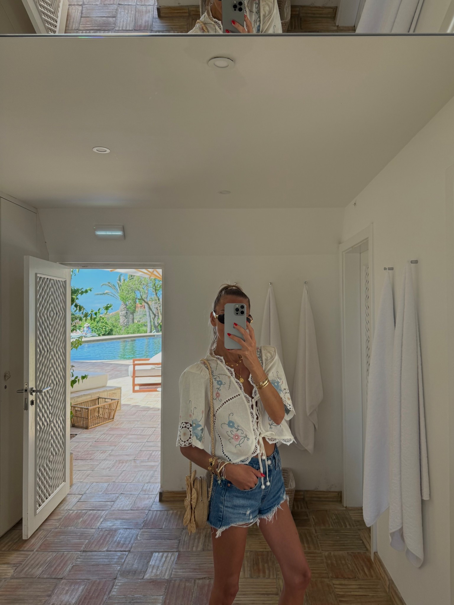 Sea nyc embroidered top, Levi’s shorts 