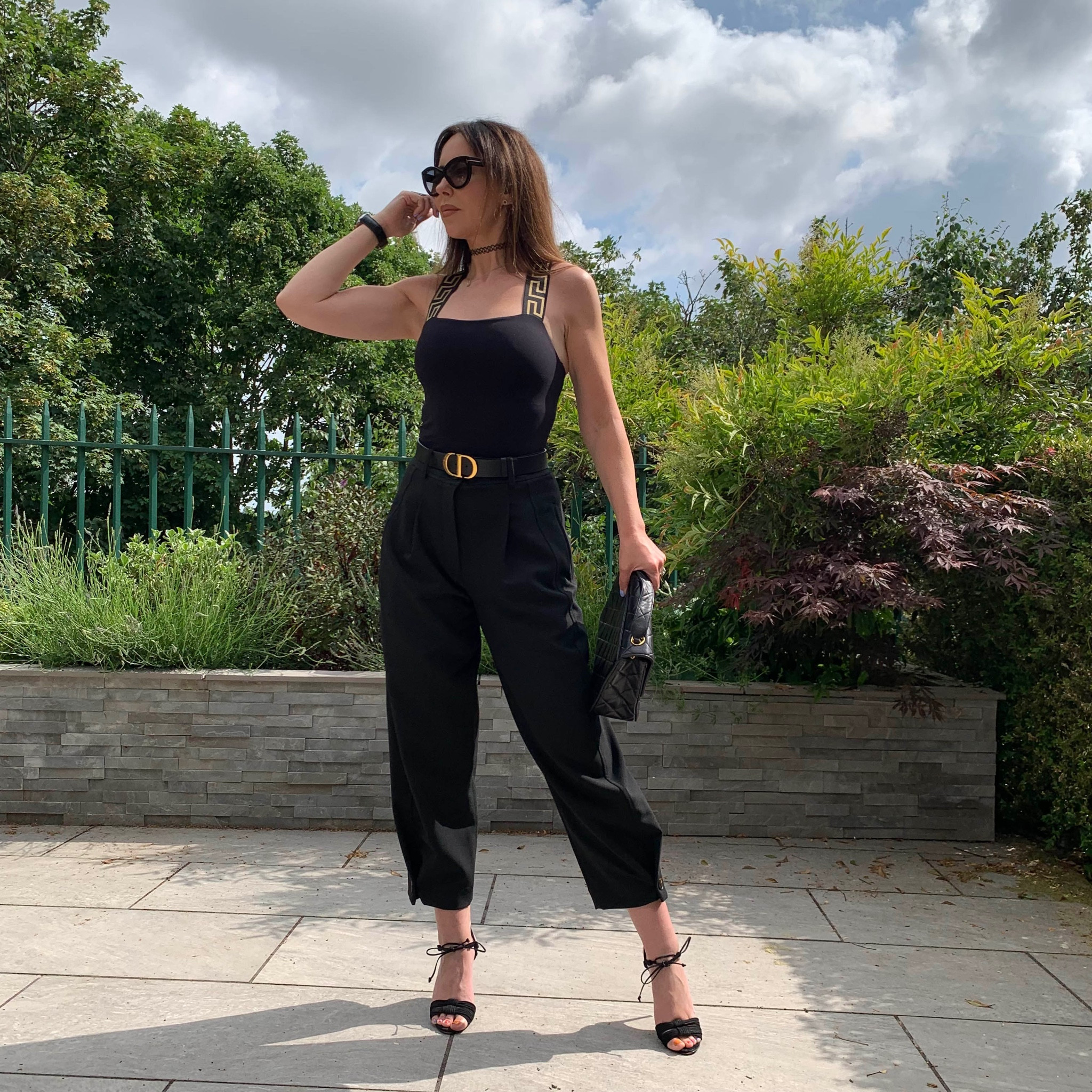 Versace key top, vest tank black top, black ankle trousers, chanel belt, black strap heels 

#LTKSeasonal #LTKstyletip #LTKeurope