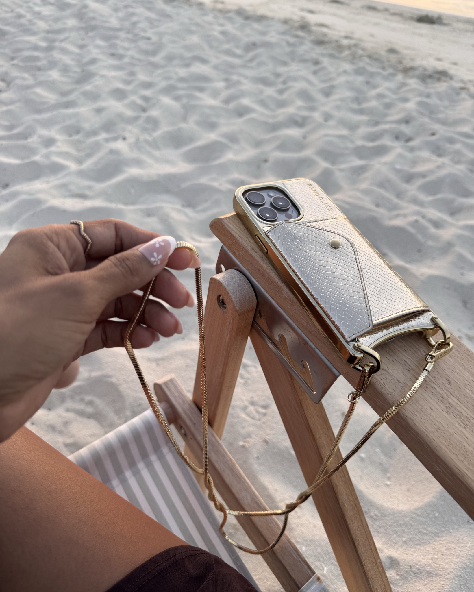 My favorite vacation accesory✨ the Gia chrome from @bandolier. This phone case duals as both a statement piece and functional yet stylish accessory! #musthave #travelfriendly #bandolier #phonecase #accesories

#LTKStyleTip