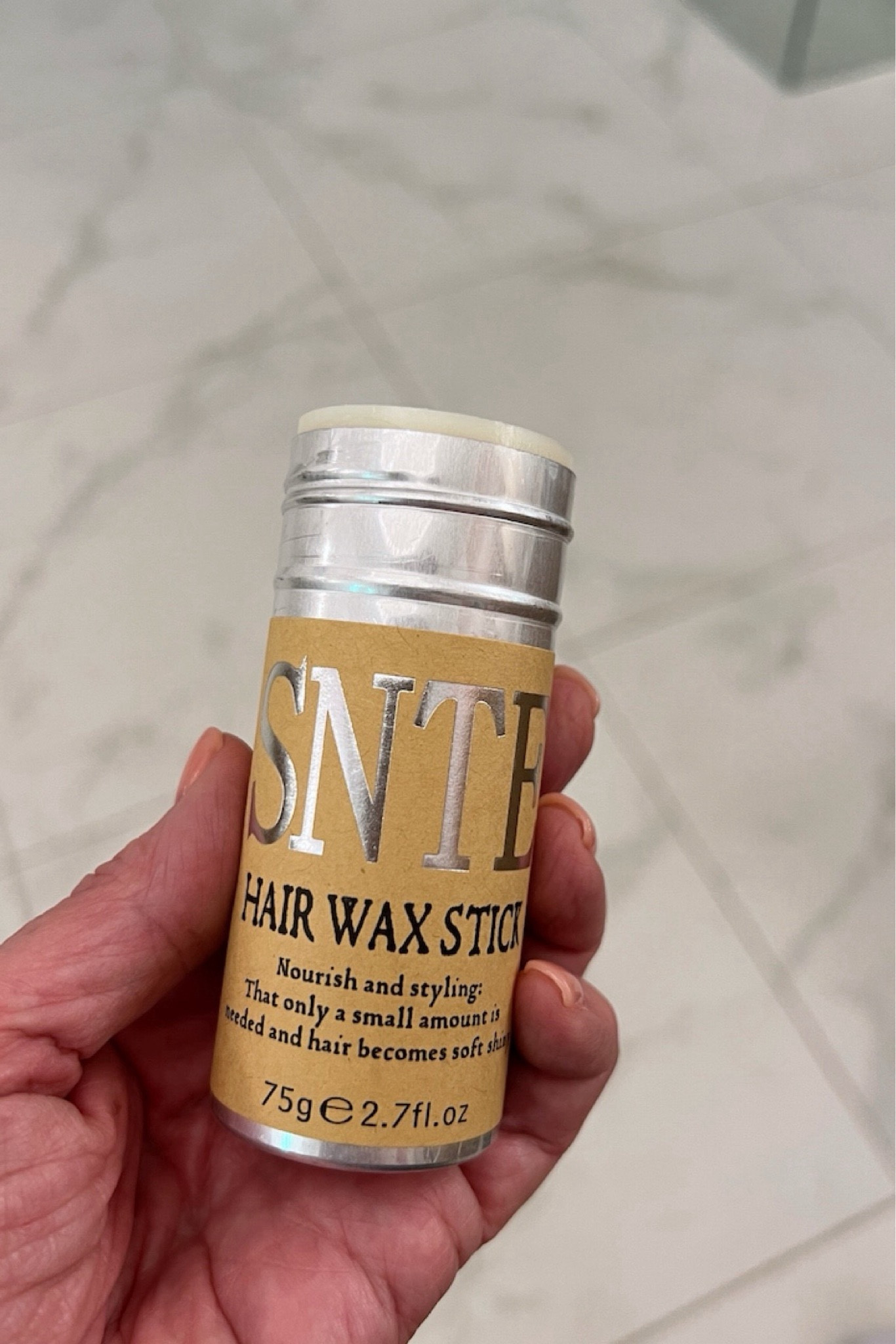 Tame your frizzy hair with this viral Samnyte hair wax stick! I love how affordable it is and it's not too sticky that it feels too heavy on my hair like other wax sticks. I use it to smooth down the flyaways and the new gray hairs that are popping up at my part that seem to want to stick straight up. Highly recommend for the whole family! #midlifeblogger #haircare #haircareessentials #productreview

#LTKSeasonal #LTKFindsUnder50 #LTKFamily