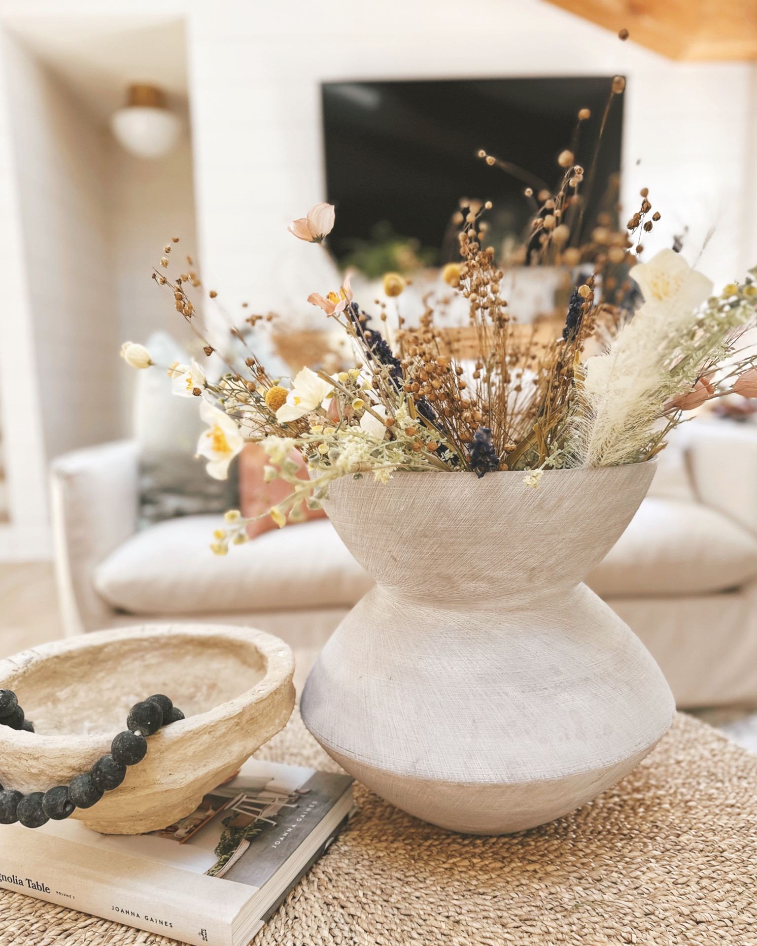 Faux and dried Spring florals from World Market in Living Room on coffee table 🤍 #stems #florals #faux #realistic

#LTKstyletip #LTKhome