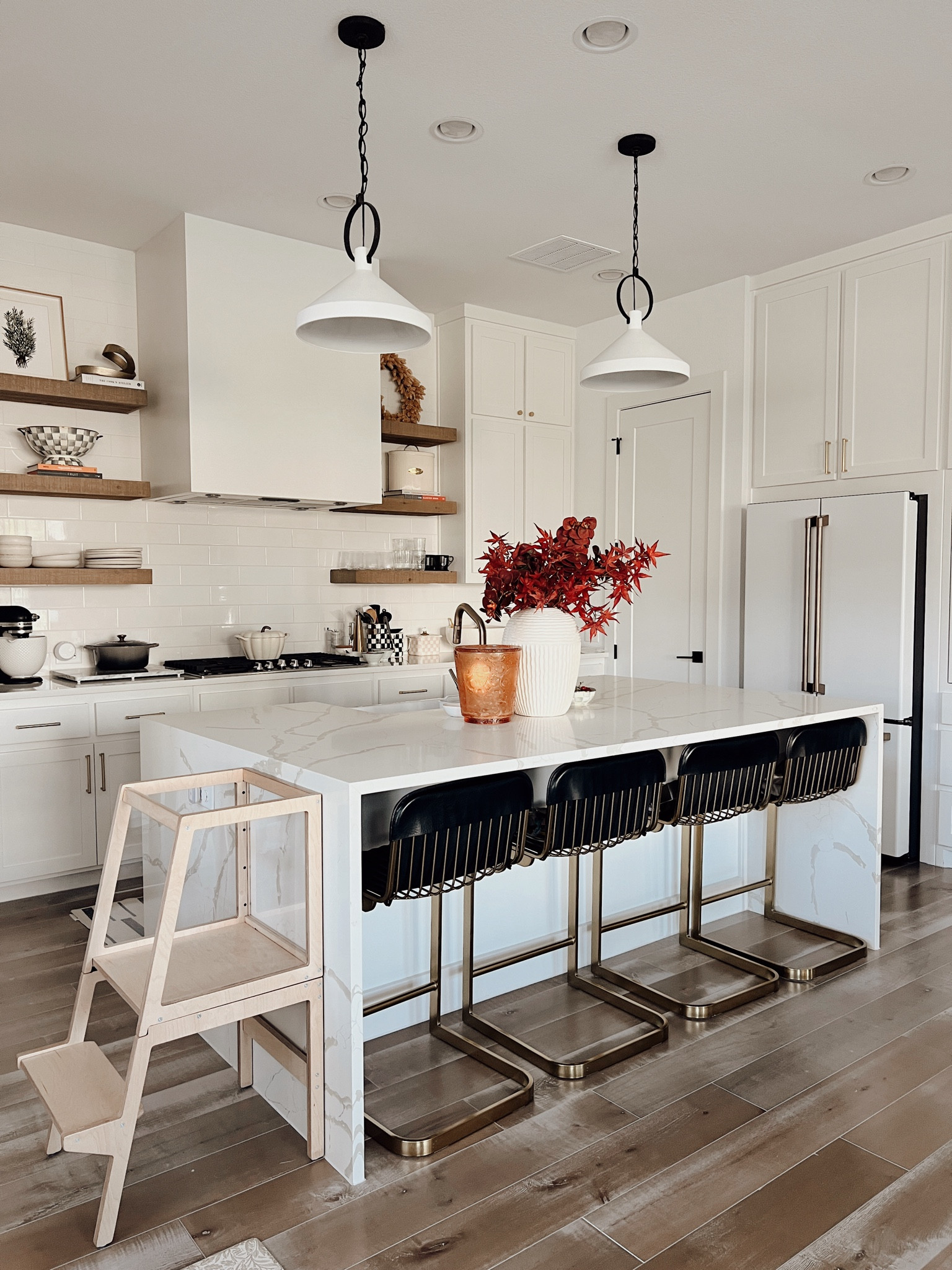 Fall kitchen decor for a transitional kitchen with a toddler tower. We love this tower because it can convert into a table with a built-in bench for little ones. The leather counter stools are easy to clean and comfy. Linking similar fall stems including Japanese maple and red orchids. Also linking all of my MacKenzie-Childs essentials. 

#LTKSaleAlert #LTKHome