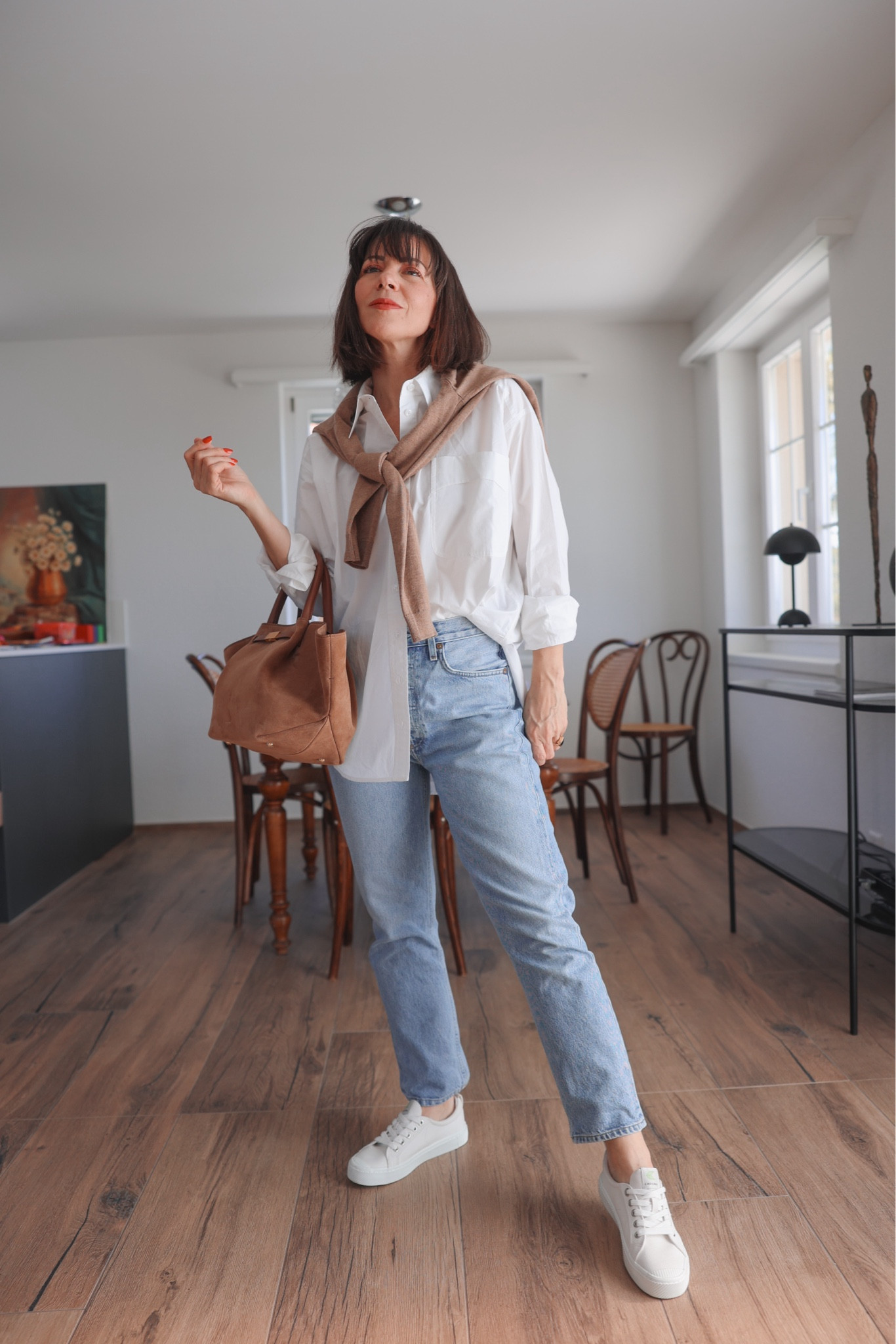 White oversized shirt, half-tucked for a more casual style, lighter washed denim for Spring vibes, tan sweater over shoulder to elevate the look, white sneakers because I will have to run around with my daughter and a suede tan tote for all of our belongings. 

Shirt: Darling,
(AUDREYB for 15% off)
Jeans: Agolde Riley
Bag: Demellier
Shoes: Cariuma
Sweater: Sezane



#LTKstyletip #LTKeurope