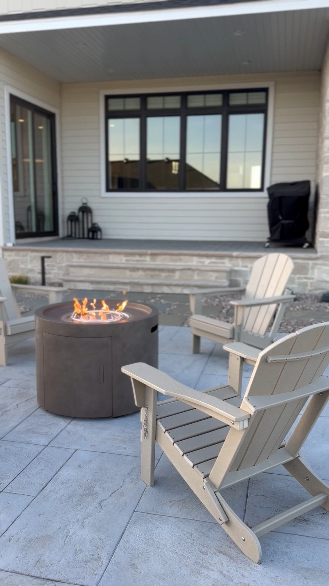 #ad One of my favorite areas in our backyard! We added these sand colored Adirondack chairs last summer and we still love them! The perfect chairs to circle around a fire pit. I researched a ton of options and found the best price on @Wayfair! #wayfairpartner #wayfair

#LTKHome #LTKSeasonal #LTKSaleAlert