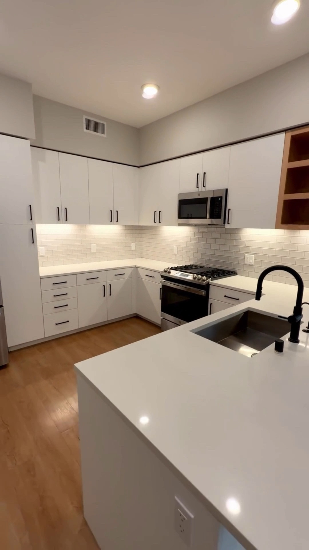 Turning this modern neutral kitchen into something warm, layered, and intentional. White cabinets + black hardware are the perfect foundation and now it’s all about texture, wood tones, and elevated everyday pieces.

Sharing kitchen decor and styling details: neutral countertop accents, statement vase, chic cutting boards, and one of my favorite luxury candles for that “home that smells like home” energy.

If you love timeless decor, neutral kitchens, and soft feminine touches in a modern space, everything is linked here for you.

#LTKHome