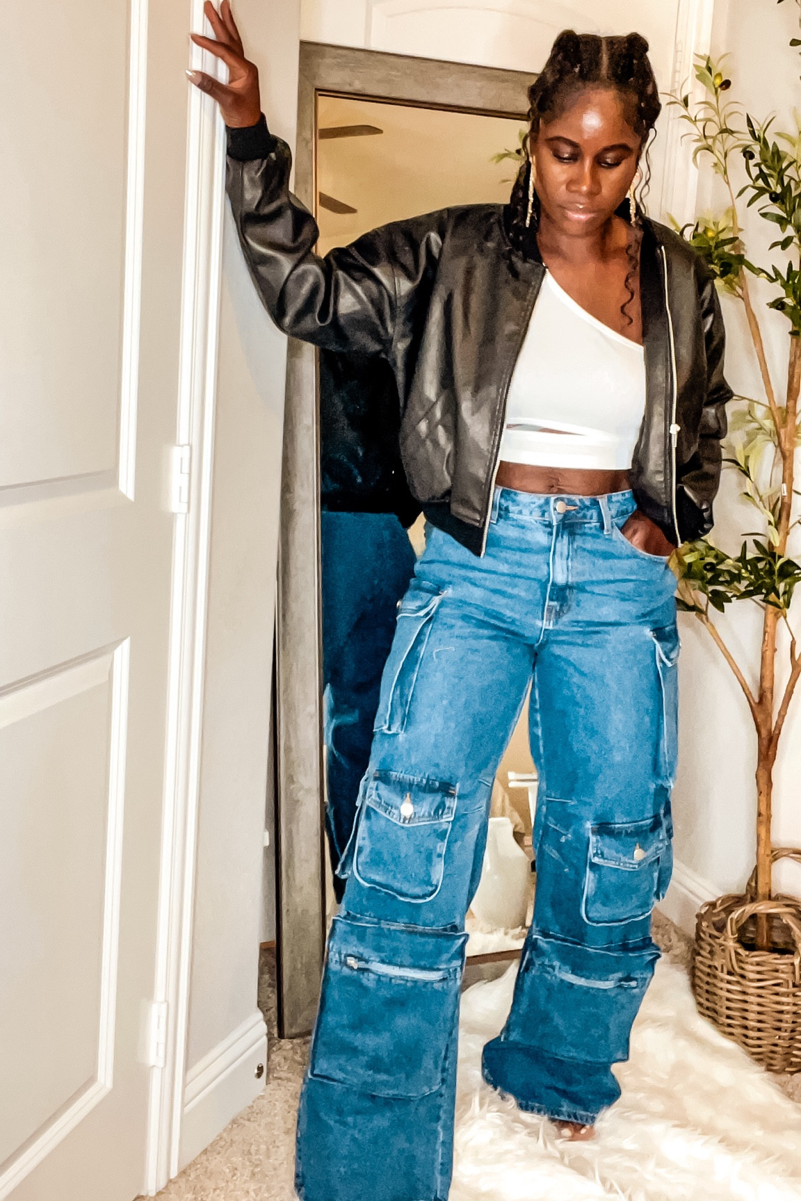 
Chic Urban Streetwear with Denim Cargo Pants and Black Leather Jacket

Step up your street style game with this trendy look featuring a cropped black leather jacket paired with high-waisted denim cargo pants. This outfit perfectly combines urban edge and casual comfort, making it an ideal choice for a day out in the city. The white crop top adds a touch of simplicity, balancing the boldness of the jacket and the cargo pants. Complete the look with statement earrings for a chic finish

#LTKSeasonal #LTKFindsUnder100 #LTKSaleAlert