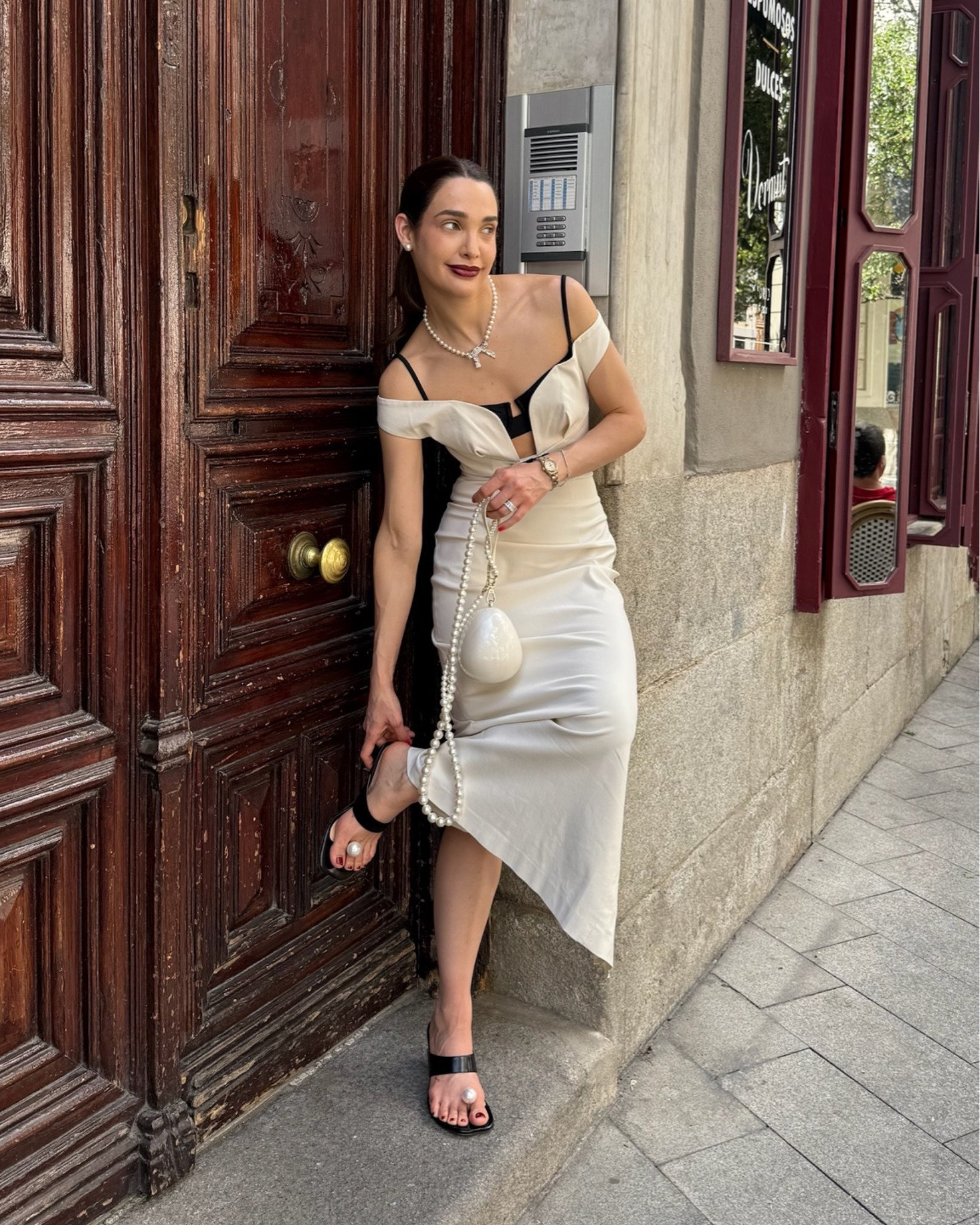 Pure elegance for a European evening out! 🤍 Elegant Off-the-shoulder white column midi dress featuring black contrast strap details, paired with a sculpted pearl clutch, bow necklace, and black thong heels. Everything is linked below to shop the look! 🕊️✨

#LTKootd #LTKgrwm #LTKU