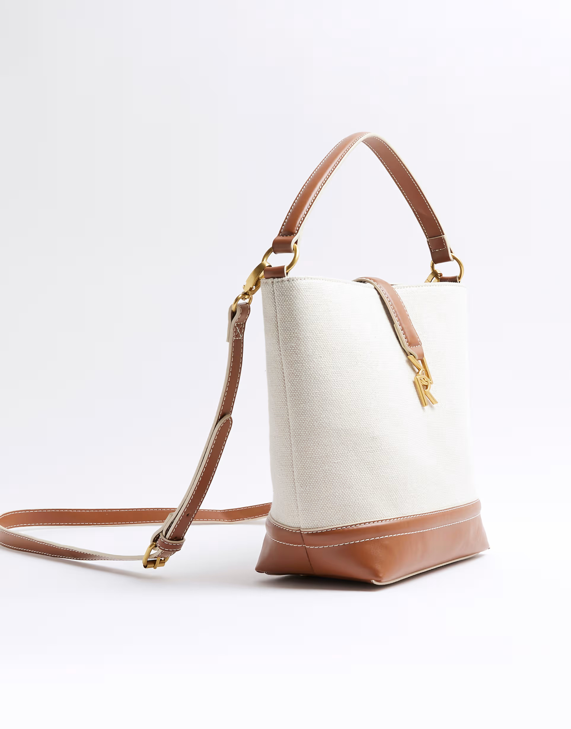 River Island Canvas lock bucket bag in cream | ASOS (Global)
