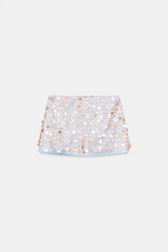 Model height: 183 cmShort skirt in satin fabric with sequins. Side zip fastening hidden in the se... | Zara UK