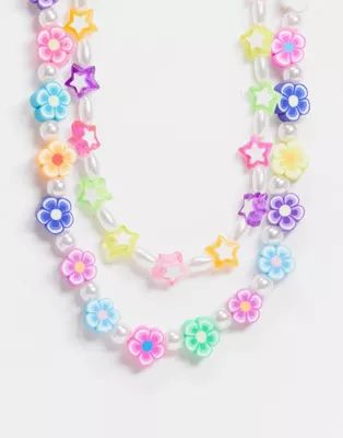 ASOS DESIGN pack of 2 necklaces with star flower and pearl bead | ASOS (Global)