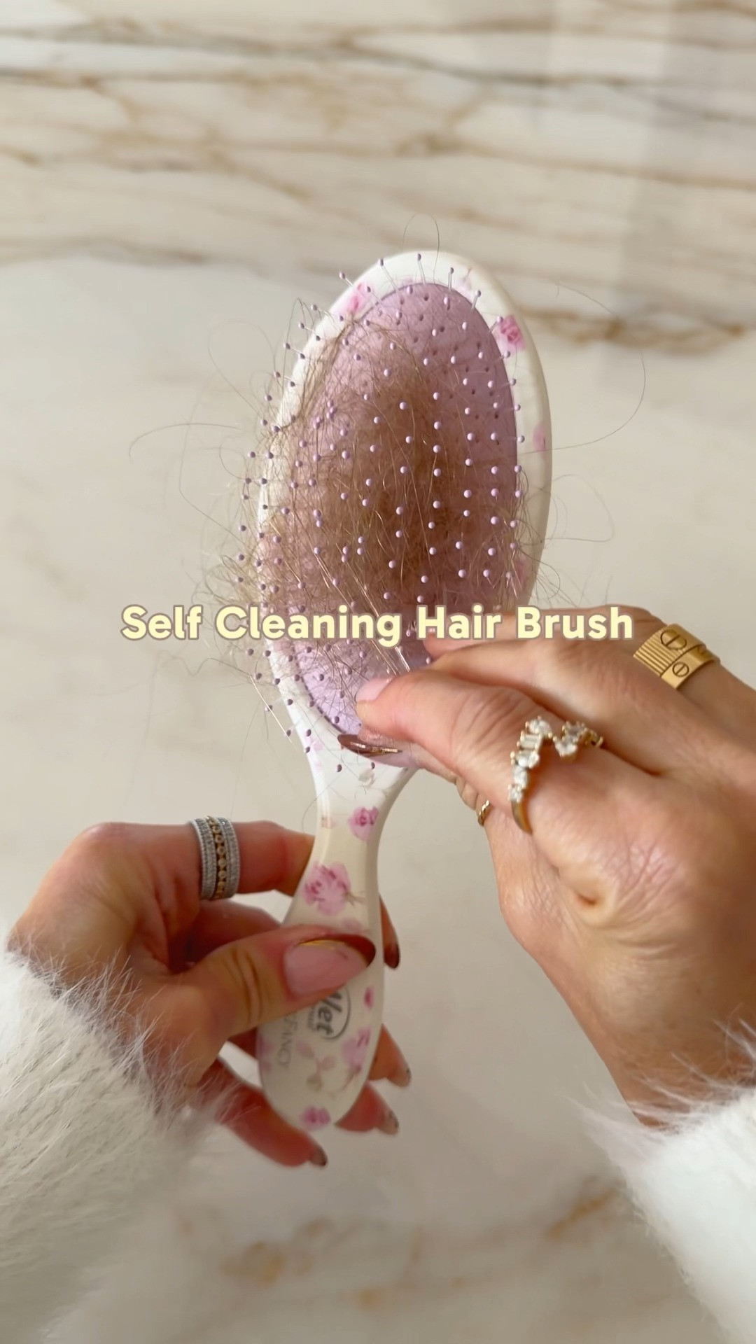 This foldable hair brush is the perfect little beauty essential for your bag. ✨ It works on wet or dry hair, folds down for easy storage, and features a self-cleaning design that makes removing hair from the brush a breeze. Perfect for travel, touch-ups, and keeping in your handbag! 

 #LTKgrwm #LTKmorningroutine #LTKTravel