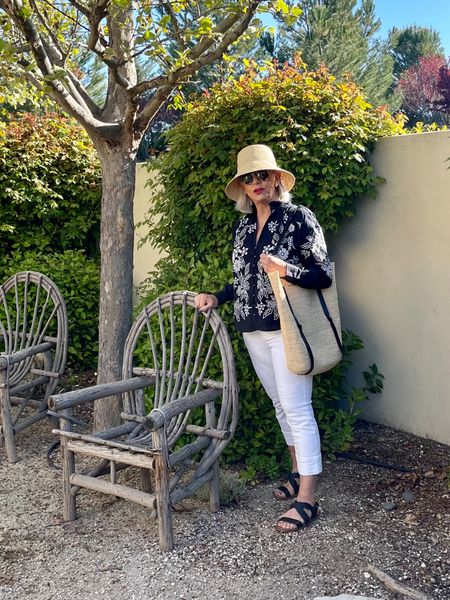 Anthropologie embroidered top white jeans summer straw hat and bag

#strawbag #over50style #whitejeans

#LTKstyletip #LTKSeasonal