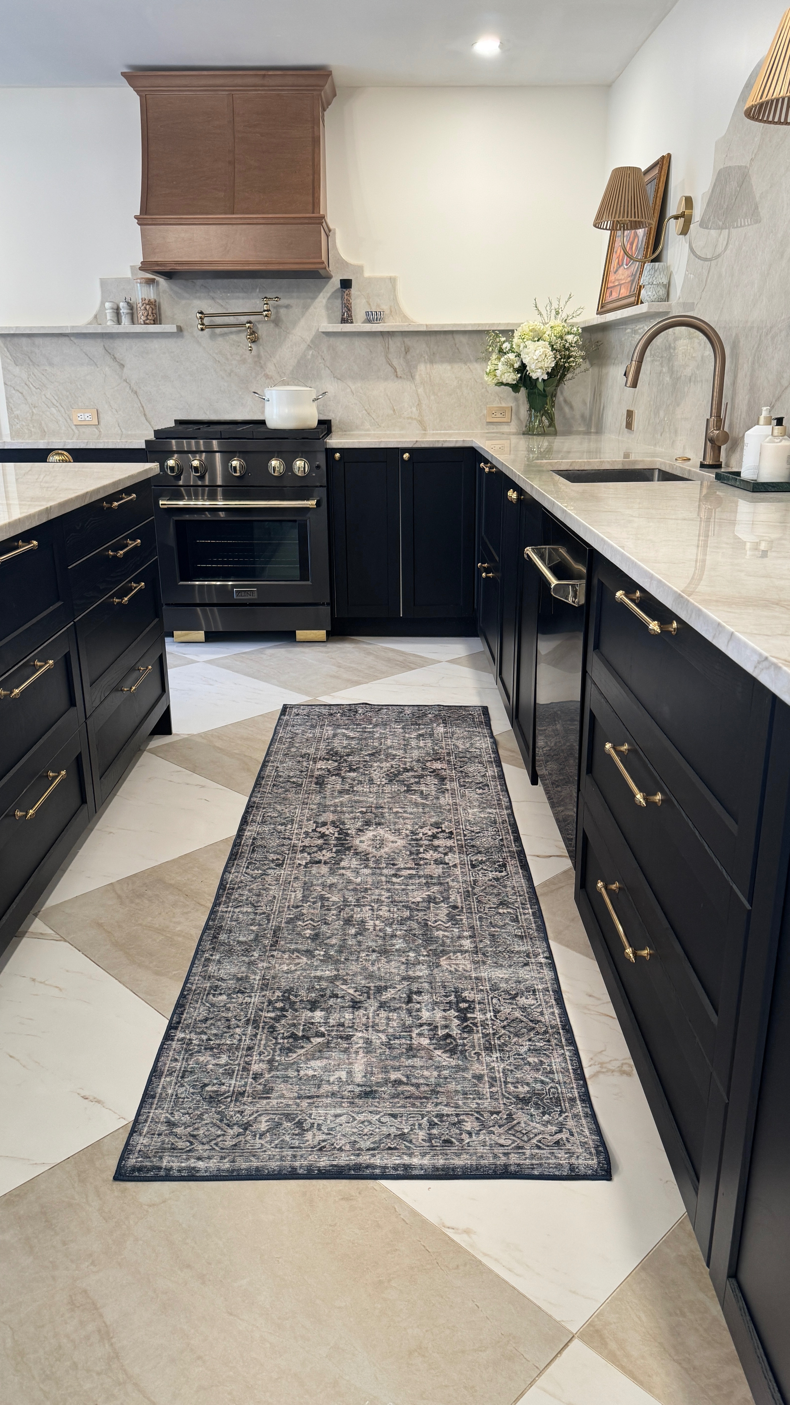 This winter, I added a new runner from Wayfair, and it completely changed the feel of the space. The navy, cream, and black tones are the perfect complement to my black and white kitchen — classic, timeless, and just enough contrast to add depth without overwhelming the room.

It instantly made the kitchen feel warmer and more inviting.

And the best part? It’s washable.
In a kitchen, that’s non-negotiable. Between accidental spills, busy mornings, and everyday life, I love knowing I can simply toss it in the wash and have it looking fresh again.

Wayfair truly has it all. I find myself turning to them time and time again — whether it’s for a cozy decor layer like this or bigger home improvement updates. It makes decorating (and actually living in) our home so much easier. 
#ad #Wayfair @wayfair #wayfairpartner 
 

 #LTKHome
