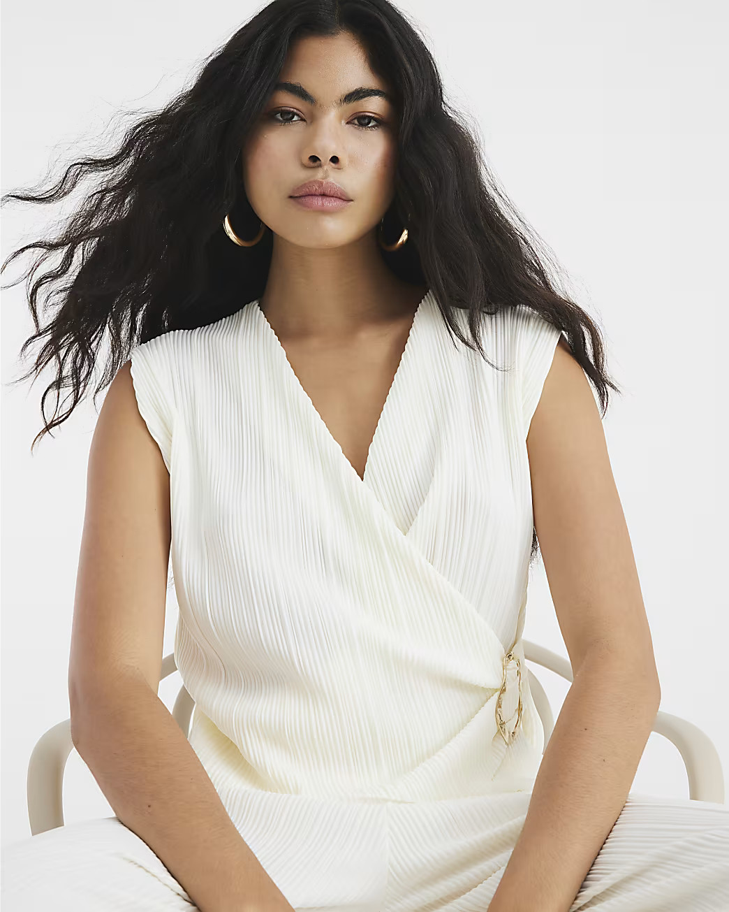 Cream Sleeveless Plisse Wrap Top | River Island UK & IE