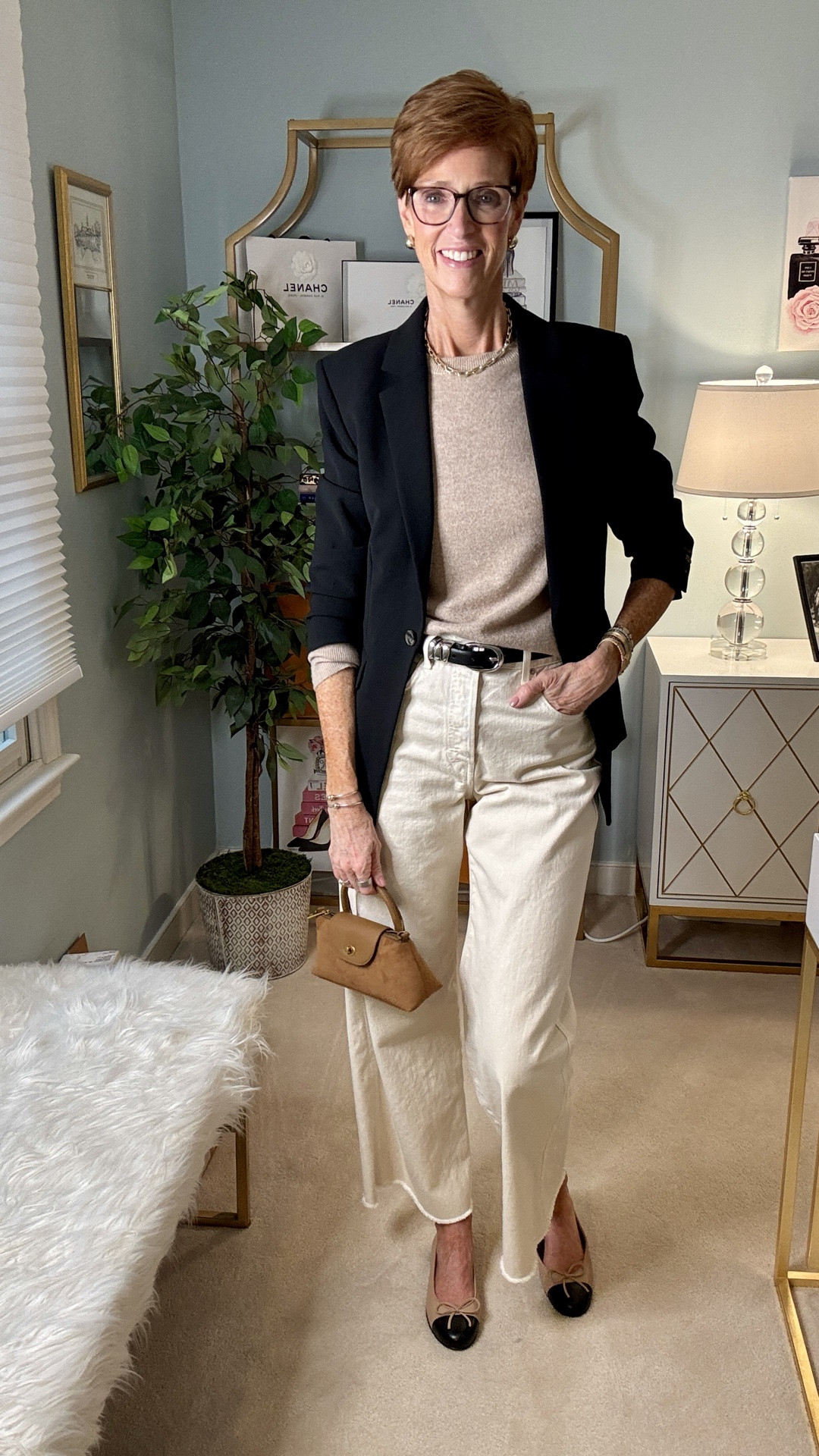 One of my favorite ways to make a classic black blazer feel more relaxed is to pair it with softer, lighter pieces. A beige cashmere crewneck, cream wide-leg jeans and cap-toe shoes give you the polish of a blazer without making the outfit feel too corporate or dressed up.

And this is exactly why I think a black blazer earns its place in a fall wardrobe. Wear it with trousers, absolutely—but then try it with jeans, cashmere, tees and other everyday pieces you already own.

Save this fall blazer outfit formula for the next time you’re staring at your closet, and send it to a friend who owns a black blazer but never knows what to do with it.

Would you wear this for work, weekend—or both?

#LTKootd #LTKOver40 #LTKTall