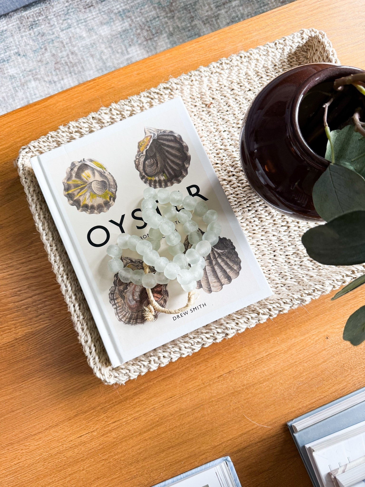 Love this oyster book on our coffee table! Also linking the mini vase and woven tray, both of which are on sale at the moment

#LTKSaleAlert #LTKHome #LTKdayinmylife