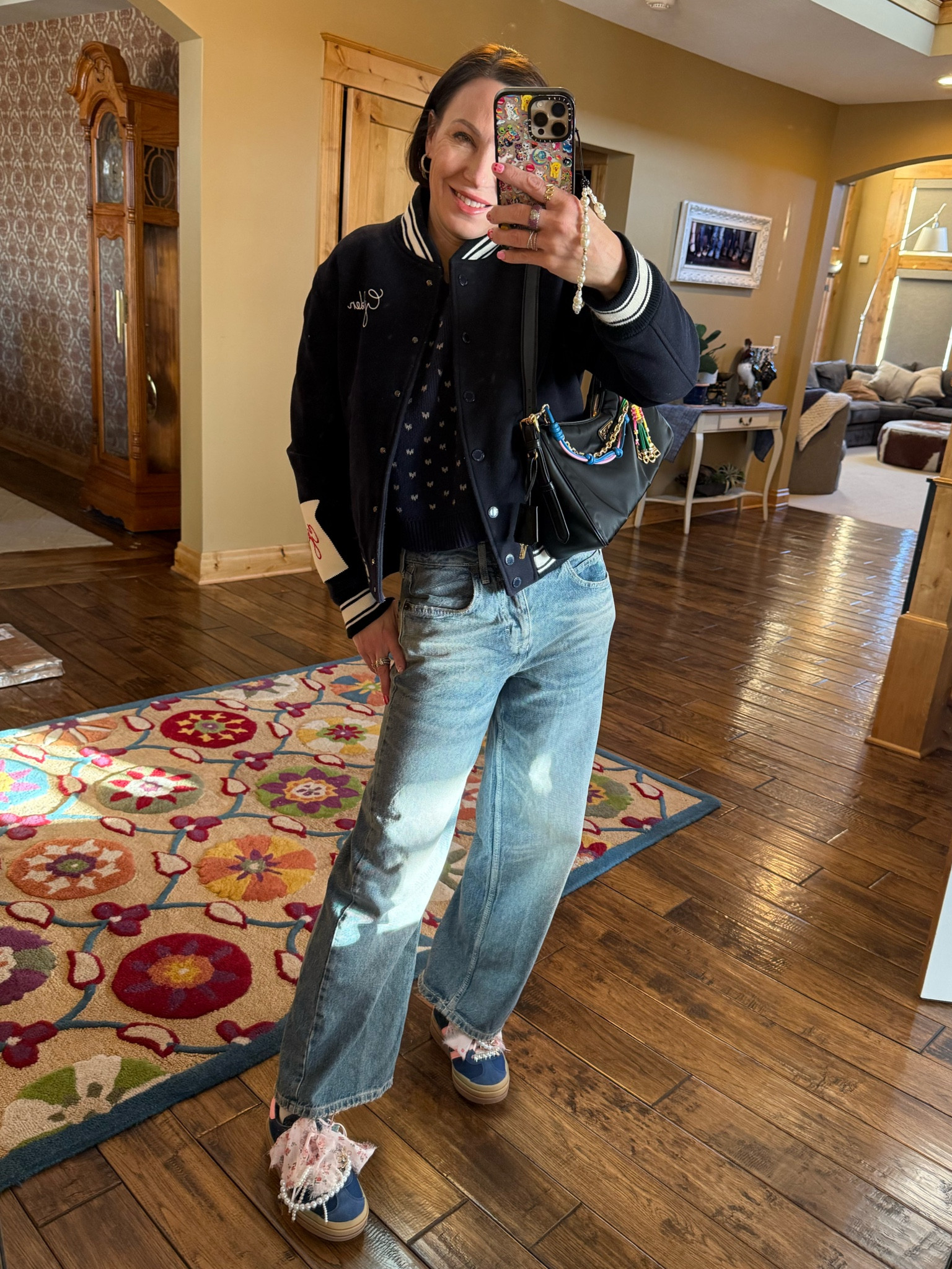 Winter outfit inspo- Urban outfitter jeans (Nordstrom), free people sweater, golden goose jacket, Adidas gazelle, embellished sneakers, Prada bag.

Casual outfit, wide leg denim, bomber jacket 

#LTKStyleTip #LTKOver40 #LTKSeasonal