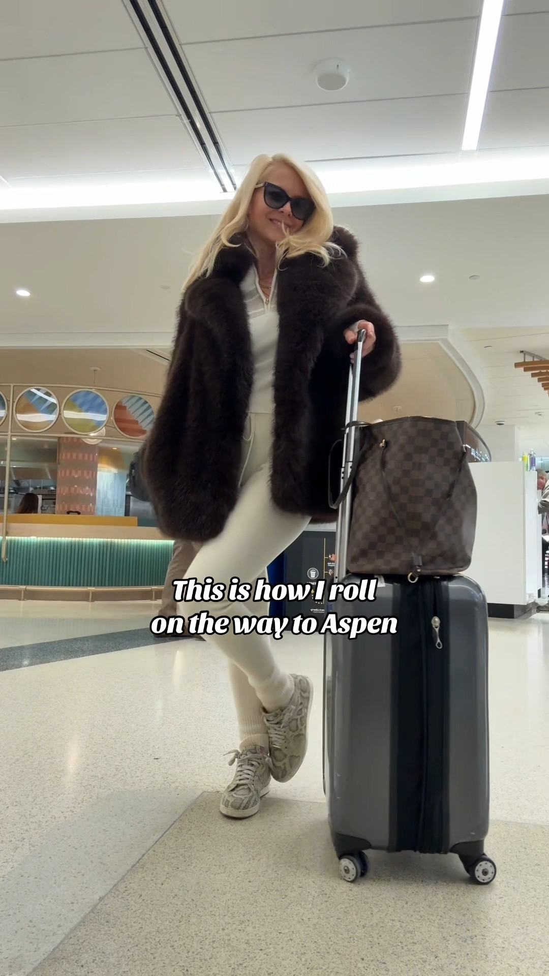 Travel outfit:  faux fur jacket in chocolate brown XS
Jimmy Choo snakeskin sneakers size 7
Matching set in cream XS

#LTKPetite #LTKootd #LTKTravel