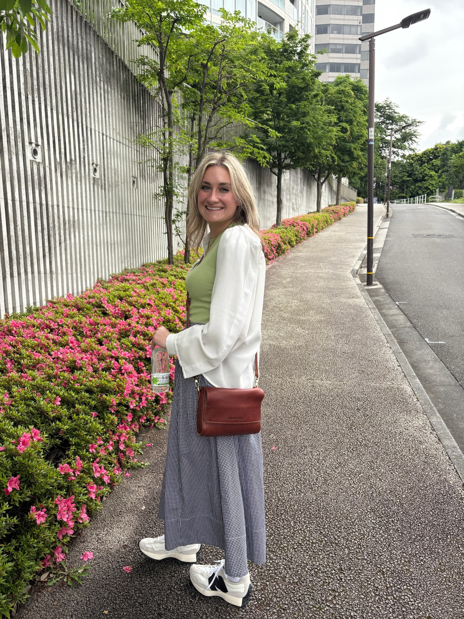 Sleepy after my work trip, I got myself together to explore Akasaka with Tyler on day 1 of our trip. It was chilly but humid, so I threw on an old navy tee and button down for some layering in case it got colder. This plaid maxi skirt from aerie was another staple this trip. Light and airy while still being fashionable. I topped it off with a tan purse and new balances to complete the comfy look. 

#LTKTravel