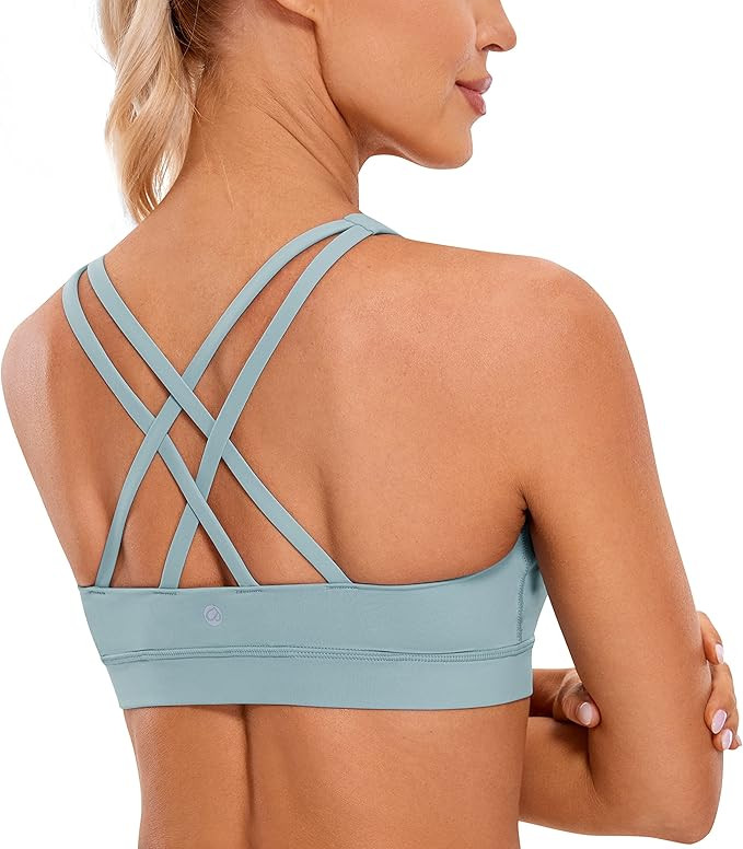CRZ YOGA Women's Strappy Sports Bras Fitness Workout Padded Yoga Bra Criss Cross Back | Amazon (US)