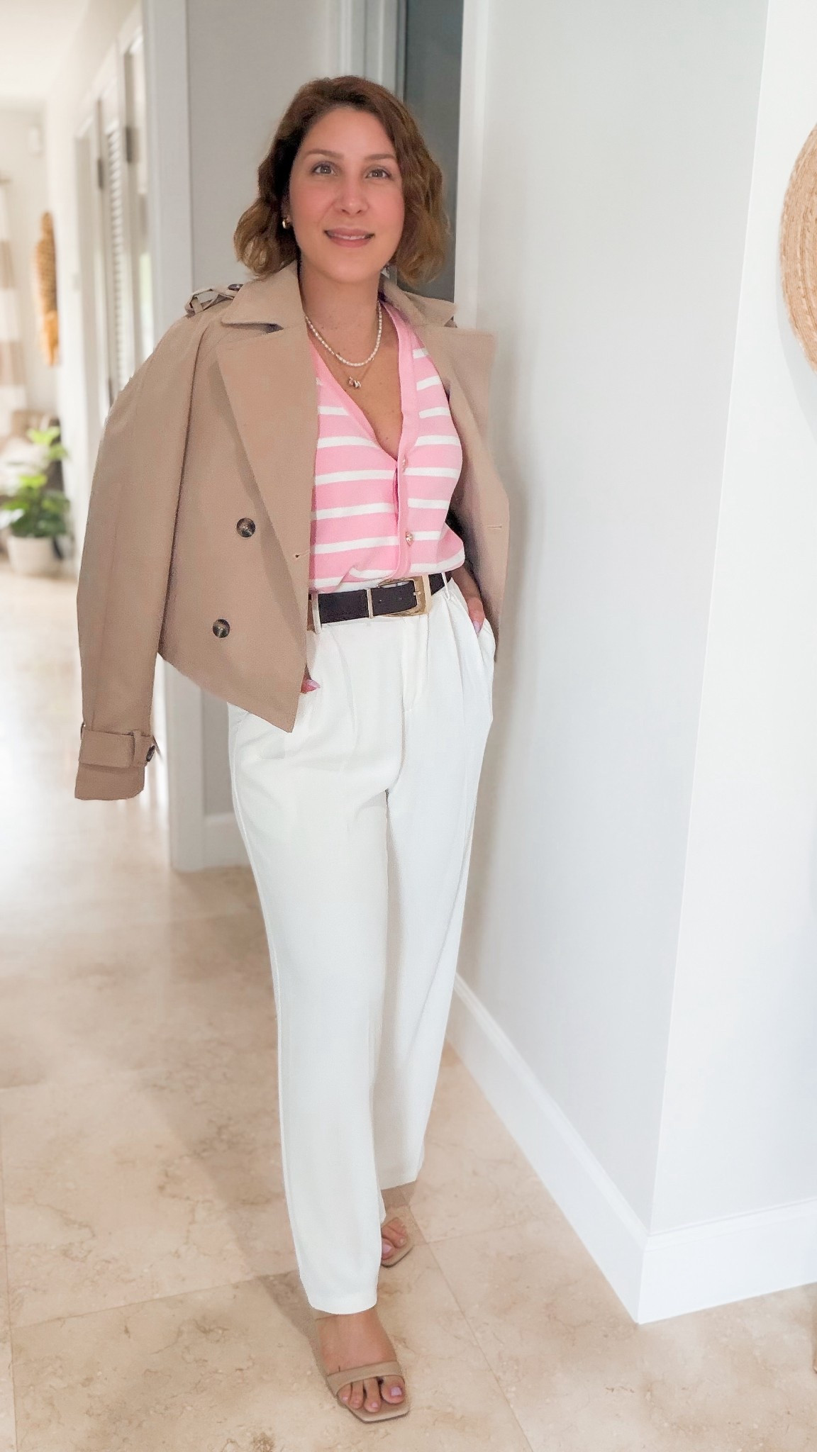 Pop of color for spring. Pink stripe knit sleeveless top with crop top raincoat and white pants  