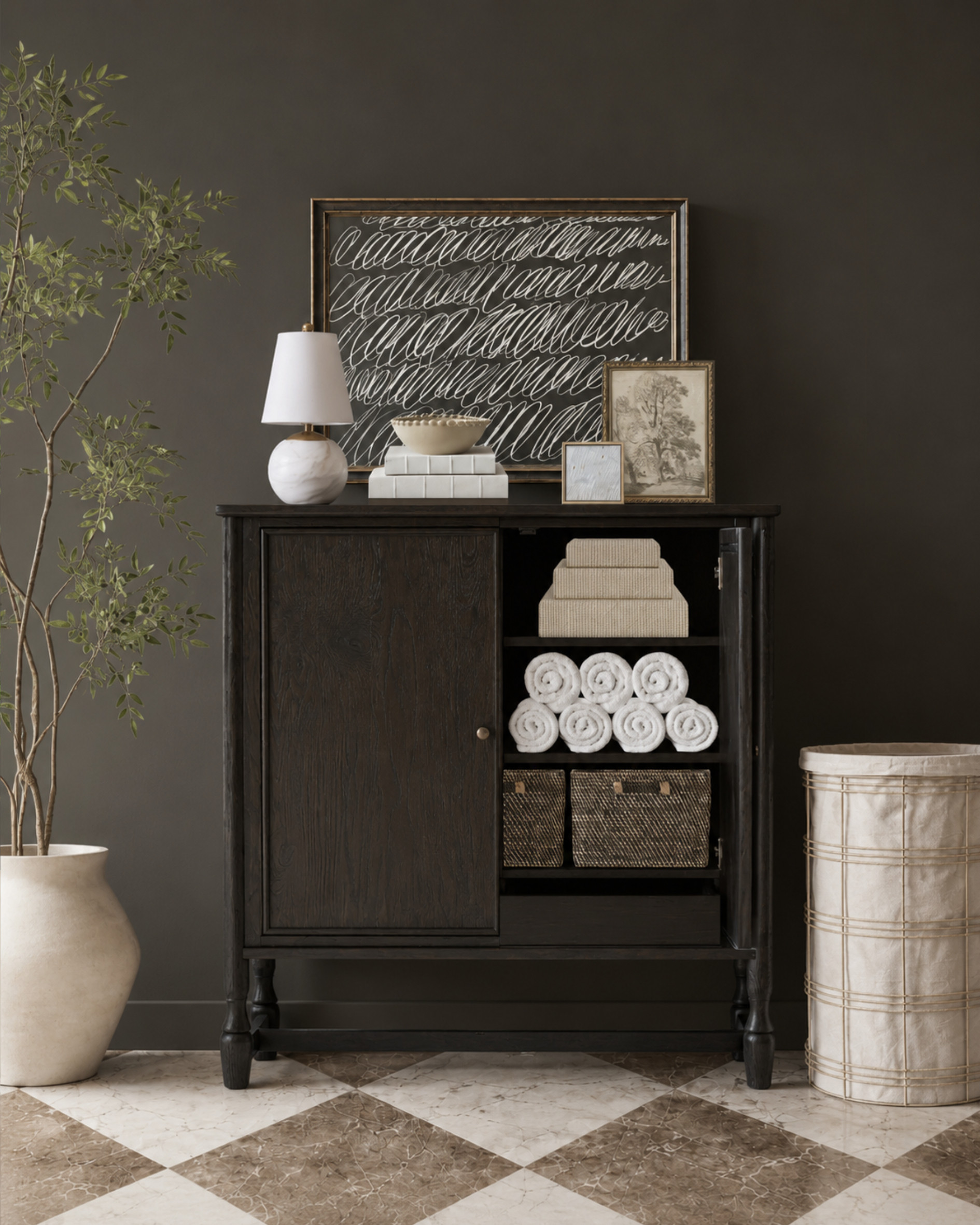 A storage cabinet is one of the easiest ways to make a laundry room feel more finished. Use it for towels, cleaning supplies, extra baskets, folded linens, and overflow laundry essentials, then style the top with art, a lamp, books, and a decorative bowl so it feels like part of the room instead of just storage. This is a great solution for laundry rooms, mudrooms, hallway storage, and utility spaces that need extra function without looking cluttered.

I may receive a commission from qualifying purchases.

laundry room cabinet, laundry room storage, linen storage, utility room storage, towel storage, laundry room decor, storage cabinet, woven baskets, classic home decor, organized laundry room 

 #LTKHome