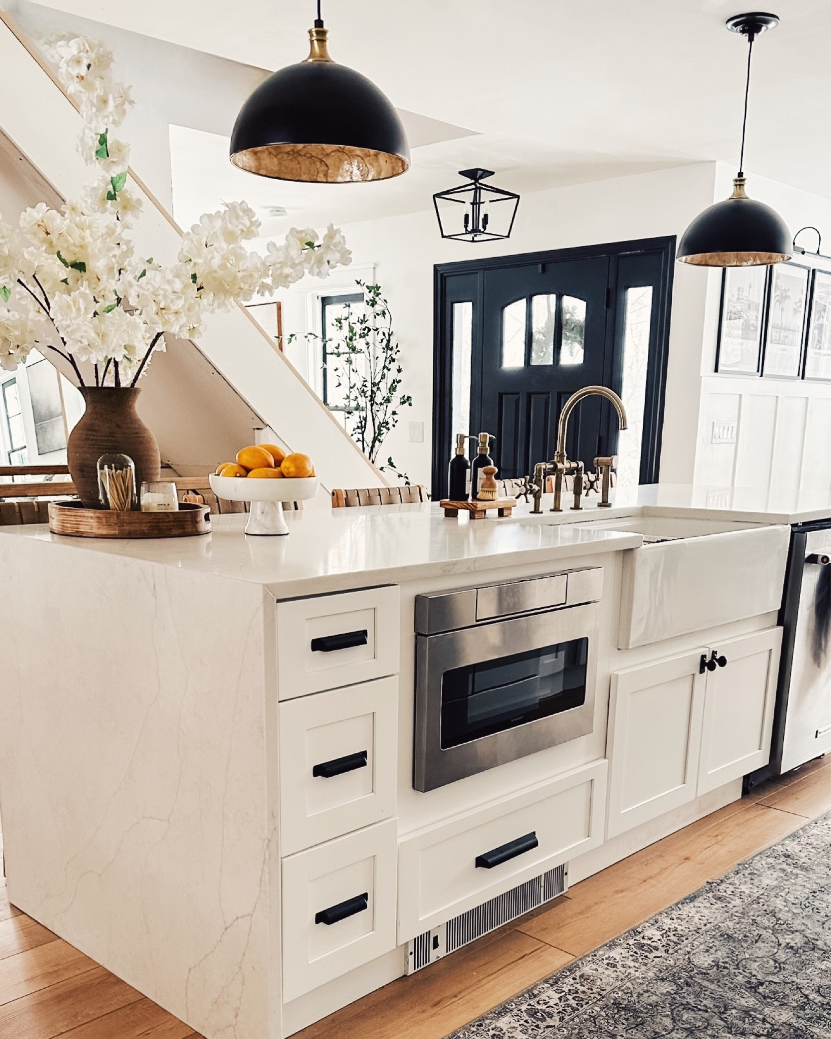 Light and airy! White kitchens will always be in style and if you saw my before photos of my kitchen you’ll see why I chose to brighten it up 🤍 

🏷️ modern rustic kitchen decor , spring floral arrangement , rustic vase , kitchen vignette , farmhouse sink , kitchen pendant lights , kitchen runner , fruit bowl , lighting for kitchen 

#LTKMostLoved #LTKhome
