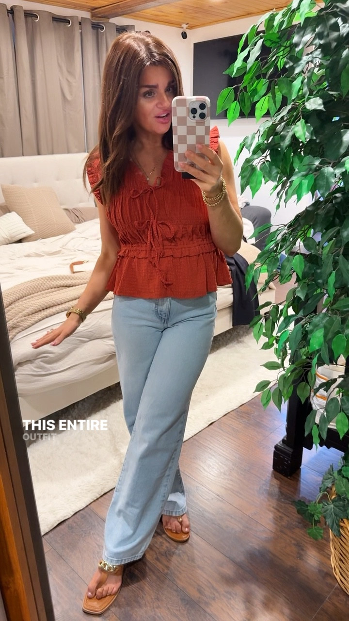 Wearing extra small in the top. It is super stretchy and it’s a little big so I would definitely size down if you are in between sizes the ties are functional so if you wanted to have it a little deeper V-neck, you could absolutely undo the top tie. It does not tighten it though.  The jeans are so good. I’m wearing extra small.  These are not jeans that you would want to wear tucked in with a shirt tucked in. It’s not going to give you that waste definition.  You would want to wear a more floaty top or a baggy top tucked in.  Think maybe a cropped sweater or something like this  on 5 foot three  the sandals are from Walmart but they’re from last  year. If you like affordable fashion, make sure to hit that follow button.

#LTKStyleTip #LTKOver40 #LTKPetite