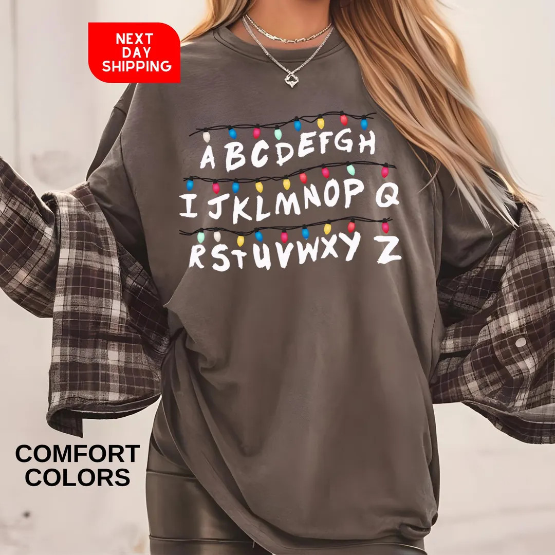 Xmas Light Tee, Comfort Colors Christmas Things Shirt, Funny Personalized Group T-Shirt, Alphabet... | Etsy (US)