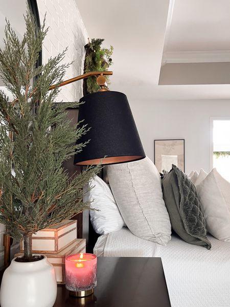 Holiday bedroom must haves. Small trees, candles, faux fur & a wreath with bells 

#LTKstyletip #LTKhome #LTKHoliday