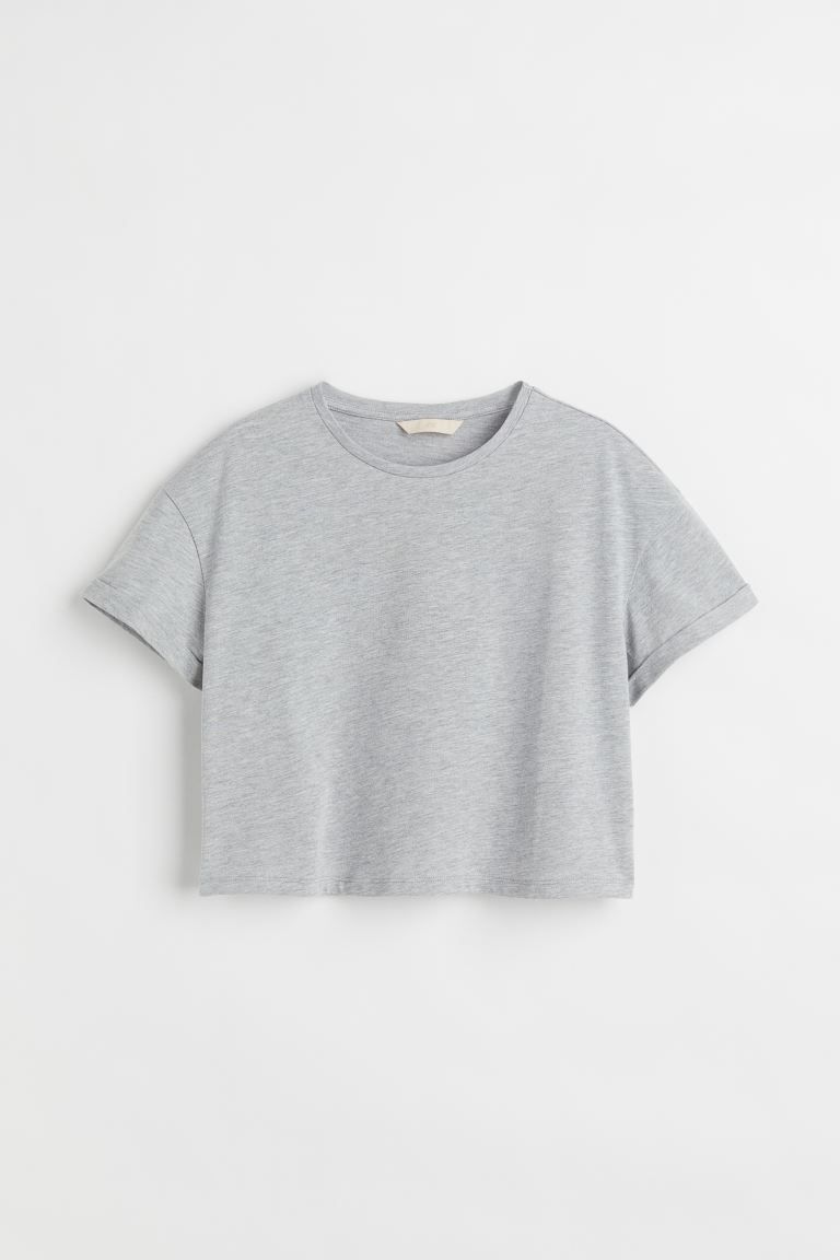 Boxy, crop T-shirt in jersey. Crew neck with narrow trim and dropped shoulders.SizeThe model is 1... | H&M (US + CA)