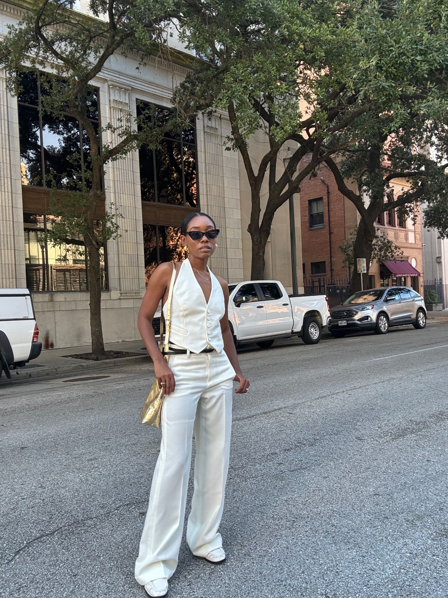 Cream trousers and halter vest and white loafers 

#LTKStyleTip #LTKPetite