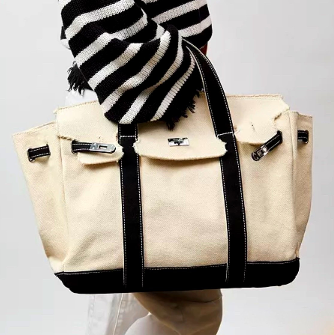 Sunwin
Madaket Large Classic Tote Bag

turn-lock belted flap closure with silver-tone hardware for secure access. Front and back slip pockets, along with canvas lining and top handles, offer organized, easy carry.

#LTKspringtrends #LTKTravel #LTKWorkwear