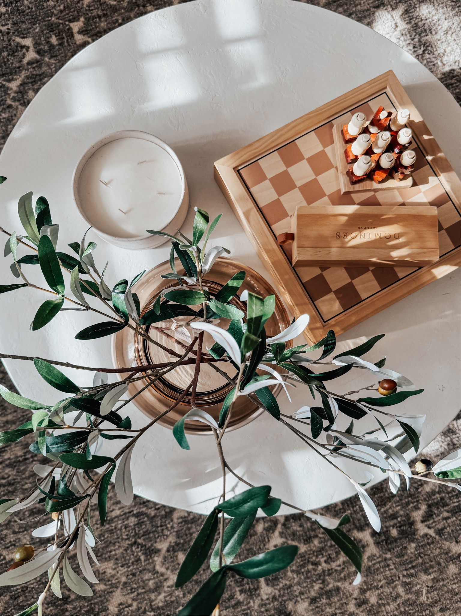 My favorite method to style a round coffee table is to arrange my decor as if they are points on a triangle. A fool proof grouping includes a vase with florals or greenery, a book stack or small table games, and a candle. Works like a charm every time! #LtKhome #roundcoffeetable #coffeetablestyling #homedecor #stylingtips #decortips #target

#LTKfindsunder50 #LTKhome #LTKstyletip