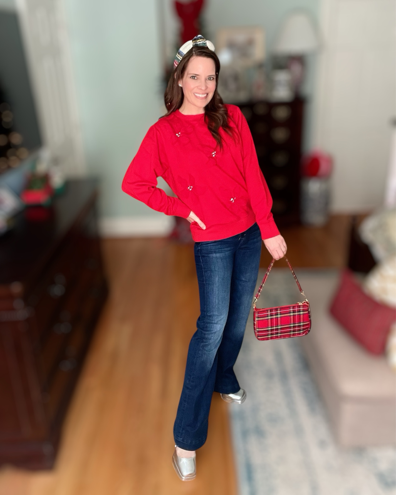 Festive Red & Tartan Holiday Outfit

Cozy, classic, and just a little sparkly — this bright red sweatshirt with floral appliqué is such a cute holiday statement piece. I paired it with dark-wash bootcut denim, a plaid padded headband, my little tartan shoulder bag, and these fun silver platform heels for a pop of shine. Perfect for Christmas parties, festive errands, or casual holiday photos at home 🎄❤️✨

Everything I’m wearing is linked, including the exact headband, bag, jeans, and shoes. The bracelets are the BaubleBar $10 sale pieces!

holiday outfit • red sweatshirt outfit • Christmas style • festive headband • BaubleBar $10 sale • tartan accessories • winter outfit ideas • holiday shopping finds • Amazon holiday accessories • cozy Christmas style • casual holiday outfit • gift ideas & stocking stuffers • budget friendly holiday style

#LTKGiftGuide #LTKootd #LTKHoliday