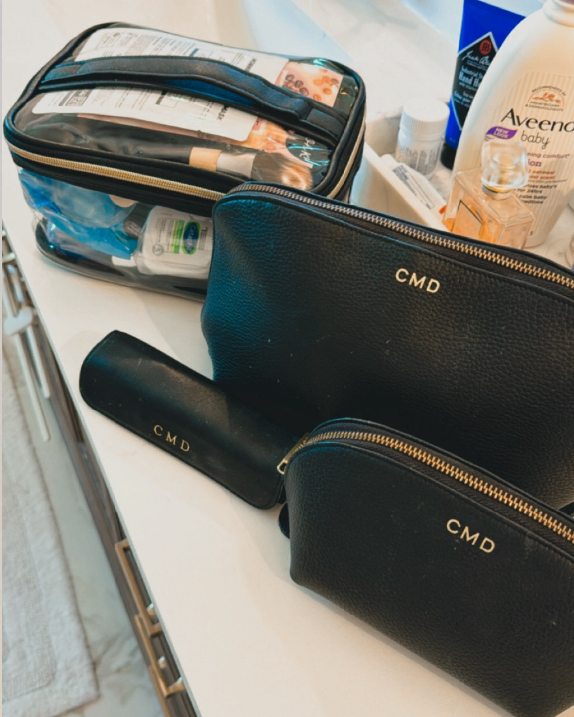 Love my high-low mix and match toiletry set. It’s taken me lots of travel and trial to find the bags that carry it all but this has been the perfect mix for real life and my budget.

1. Highly recommend investing in these cuyana matching set monogram leather bags as your core piece. The larger cuyana is big enough to hold my Dyson air wrap dupe! 
2. Travel pill case wrapped in leather and monogrammed
3. Dupe of a train case by Truffle Co that I adore 