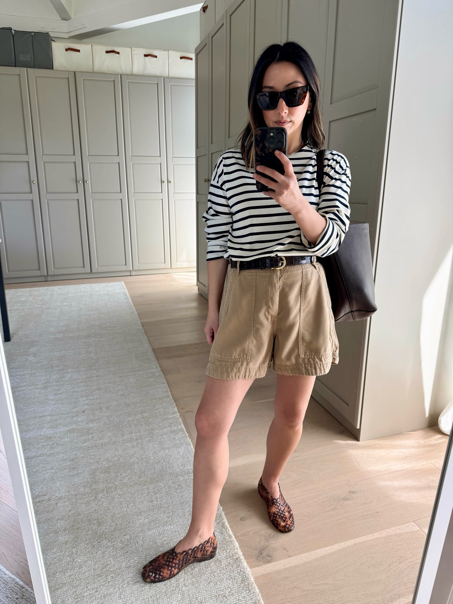 Everlane brought back their drapey utility shorts. These are so comfy and relaxed. I sized up to a 2 and they’re roomy, but I like room in my shorts. You can go tts on these tho. 

Tuckernuck tee xs
Everlane shorts 2
Steve Madden jelly flats 5
Quince bucket bag
Dorsey James necklace 15”
Electric picks earrings 
Celine sunglasses 

Spring outfits 2026, petite style, shorts, mom outfits



#LTKPetite #LTKootd #LTKmomlife
