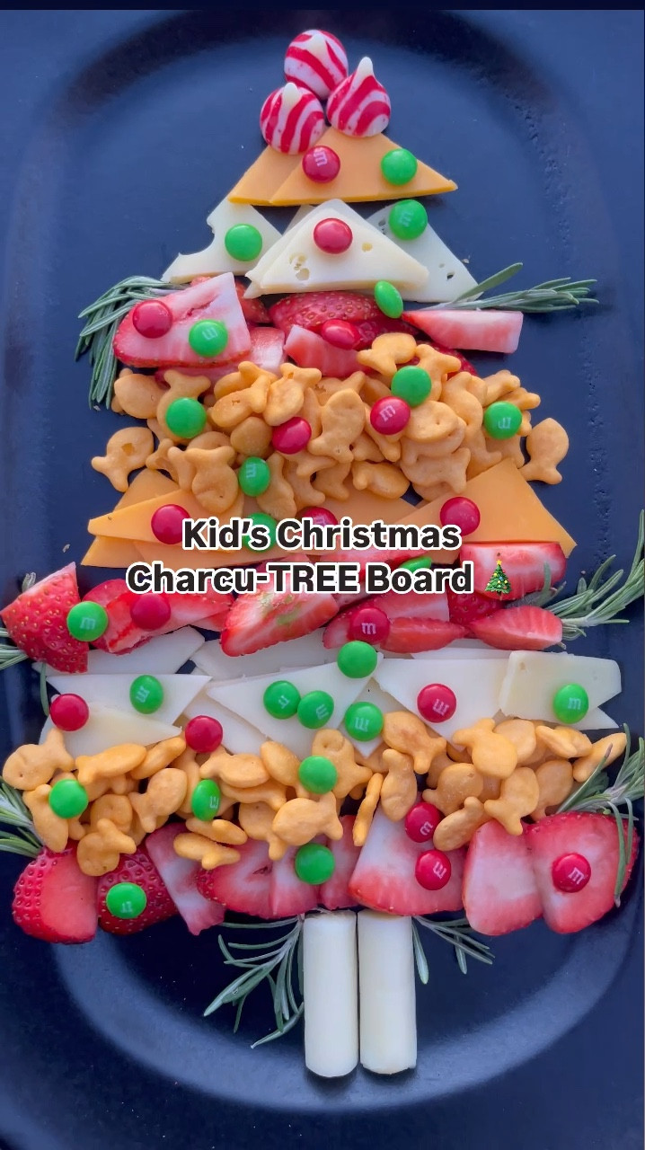 Cutest charcu-TREE for the kids this Christmas!! 🎄✨ make this darling little tree board for an after school snack this week or for a Christmas Eve or Christmas Day appetizer!! 
🎄🎄🎄
Use sliced cheese, cut into triangles, goldfish, M&Ms, strawberries, fresh rosemary, string cheese, and mints! I would also add in grapes or apples, and maybe some red and white Hershey’s kisses! 

#LTKHoliday #LTKParties #LTKKids