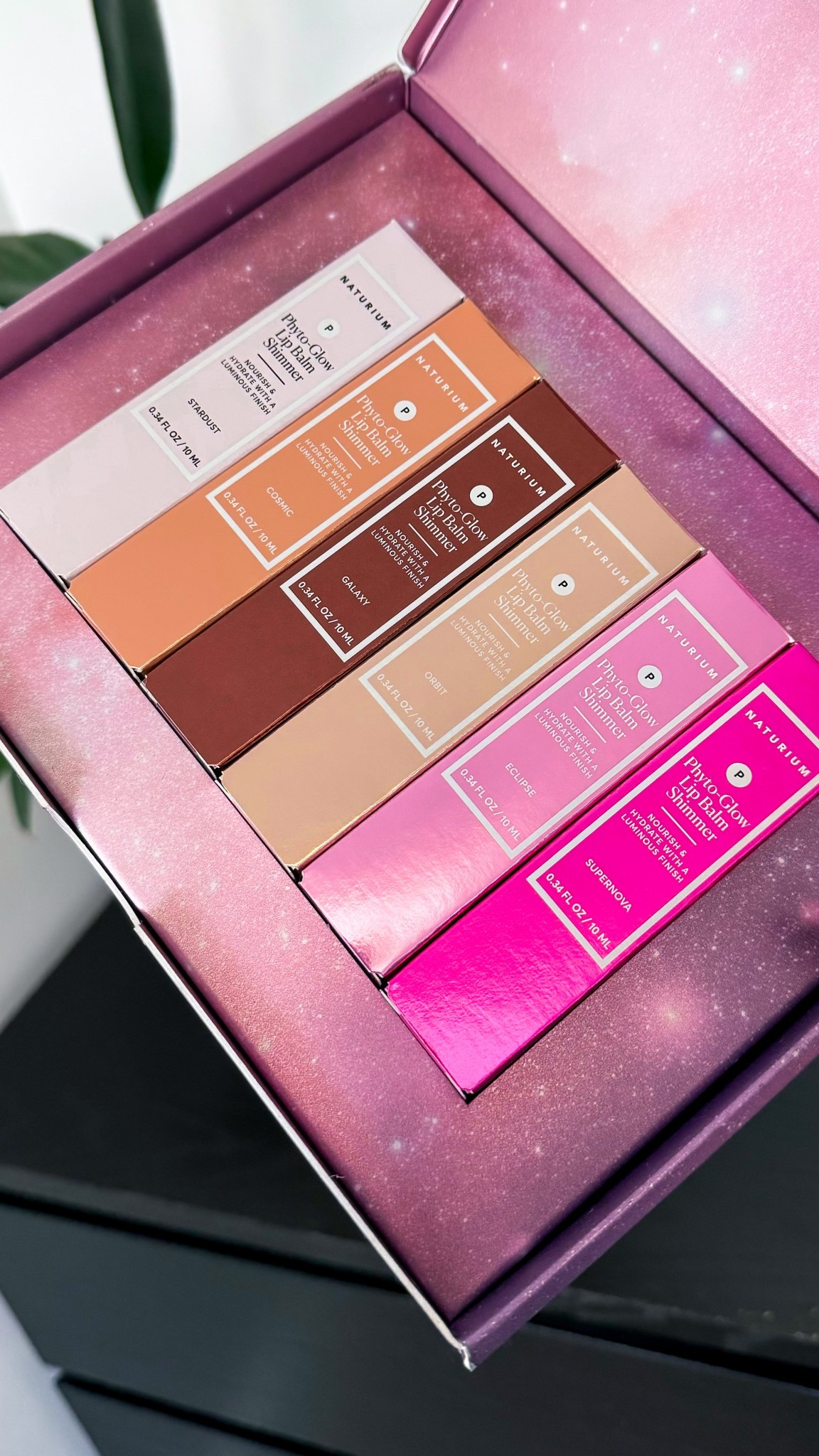 Our nourishing lip balm is formulated with shea, cupuaçu butter, plant squalane and gediamond pearls leaving lips soft and shimmering.

This high-shine formula adds a sheer wash of color with a luminous finish.

MADE WITH:
Phyto-Derived Esters
/ Lanolin alternative that moisturizes & conditions lips
/ Nourish without feeling greasy
/ Naturally add a glowy finish
Geodiamond Pearls
/ Pearlescent pigments reflect light for a multi-dimensional glow
/ Glimmering effect with pearlescent depth & dimension
Cupuacu Butter
/ Naturally soothes & conditions
Shea Butter
/ Intensely hydrates dry lips
/ Helps retain moisture & soothes
/ Provides a rich, sensorial feel
Plant Squalane
/ Leaves lips feeling supple
/ Adds weightless hydration
/ Locks in moisture

HOW TO USE:
Apply onto lips for shimmering hydration. Wear alone or layer on top of any lipstick or lip liner to add a luminous finish.
Our Phyto-Glow Lip Balm Shimmers contain natural vanilla flavor, which provides a subtle scent in addition to flavoring the formula.

@naturium #lipgloss #gifted 


#LTKBeauty