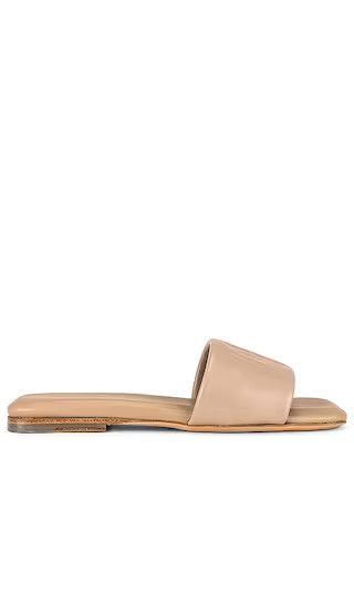 Ria Slides in Butterscotch Monogram | Revolve Clothing (Global)
