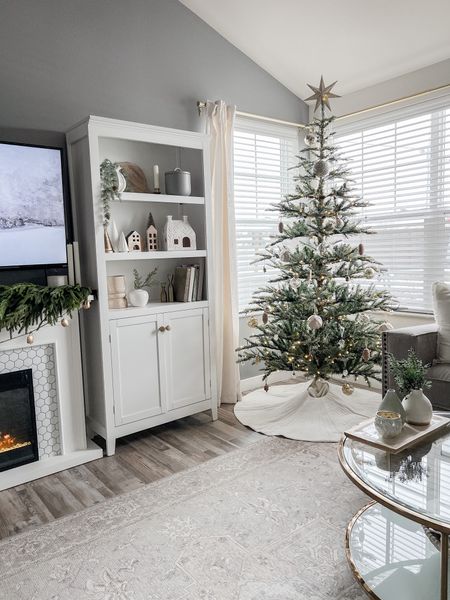 My King of Christmas King Noble Fir tree is still over 40% off with code CYBERMONDAY! 👏🏼
.
.
.
.
Christmas tree, neutral Christmas decor, white tree skirt, white bookshelf, neutral holiday decor, gold ornaments, natural tree, gold tree star, tree topper, garland, winter artwork 

#LTKSeasonal #LTKHoliday #LTKhome