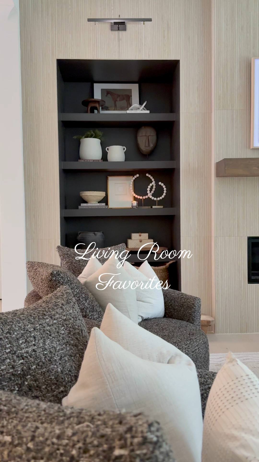 Our living room is the perfect mix of classic and modern — it’s where we wind down, host friends, and cozy up by the fire ✨

🪑 Obsessed with these swivel chairs from Lumens — so comfy, and the perfect balance of structure and softness. They anchor the space without feeling bulky.

🔥 And let’s talk about the fireplace! We swapped traditional logs for modern fire balls (affordable, from #amazon), and they totally elevate the vibe. Sleek, sculptural, and such a chic focal point alongside the fluted-look porcelain tile.

📚 Built-in bookcases, layered textures, and a neutral palette keep it timeless and relaxed — and everything is linked here so you can shop the look.#LTKLivingRoom #ModernClassicStyle #LumensFinds #FireplaceGoals #NeutralHomeDecor #BuiltIns #SwivelChairs #ModernHomeVibe #InteriorDetails 

 

#LTKHome #LTKHome