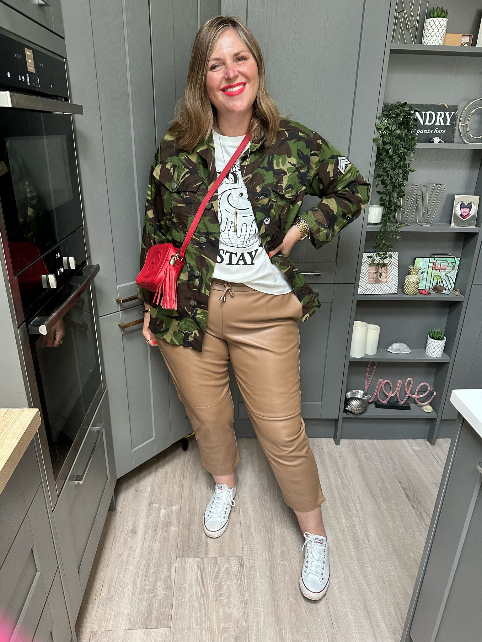 Casual outfit, camouflage jacket, tshirt, red bag, tan leather joggers, trainers 

#LTKSeasonal #LTKeurope #LTKstyletip