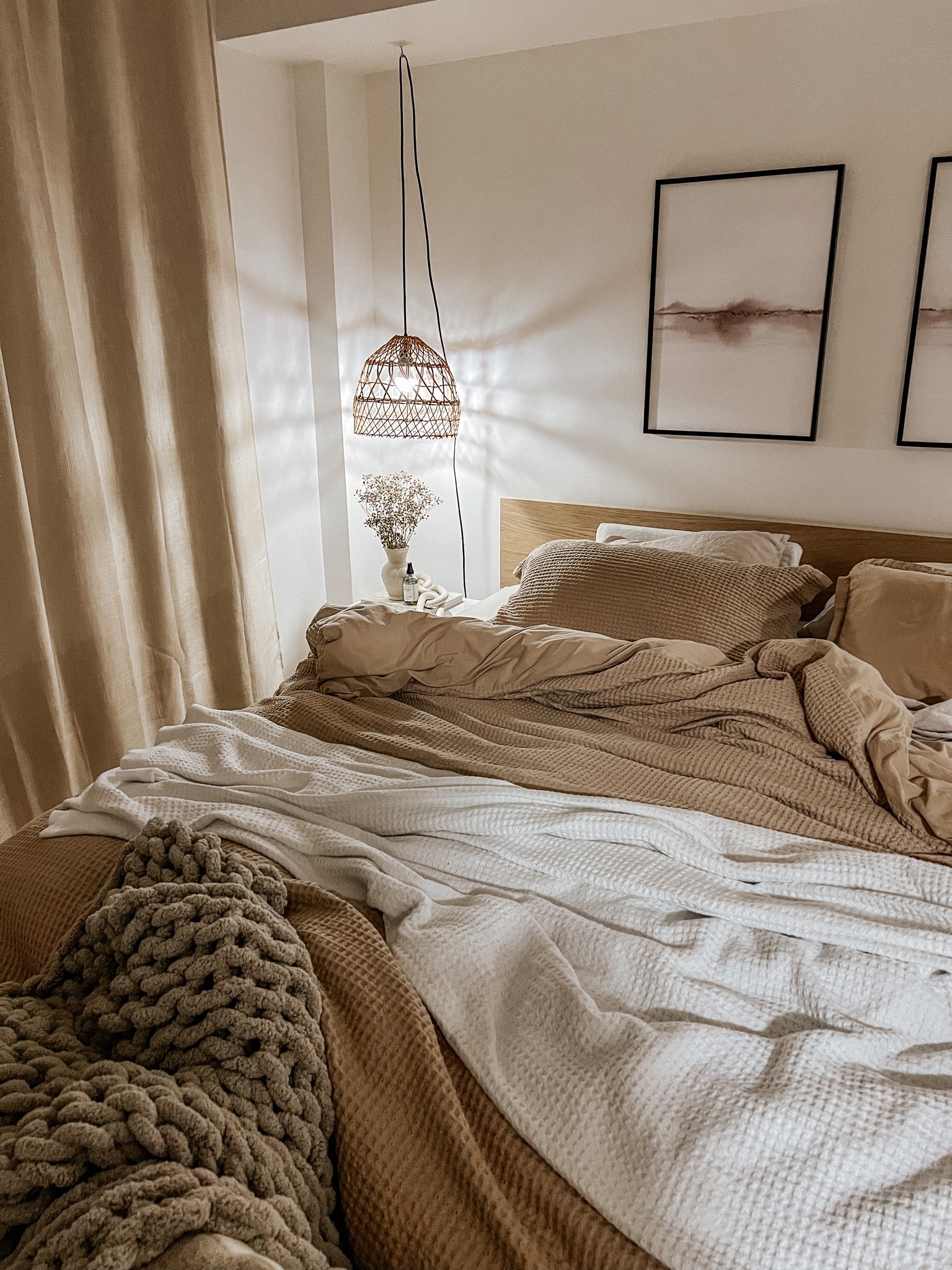 Layered neutral cozy bedding. 

Waffle duvet cover, linen sheets, neutral bedding, cable knit blanket, rattan light, cozy bedroom vibes, bedroom aesthetic 

#LTKunder100 #LTKhome #LTKunder50