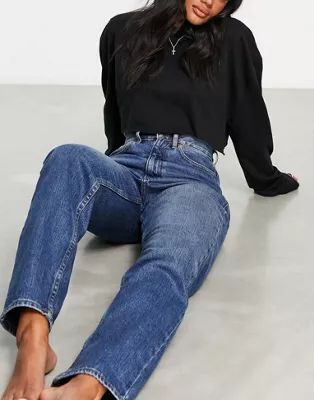 ASOS DESIGN slouchy mom jeans in mid blue | ASOS (Global)