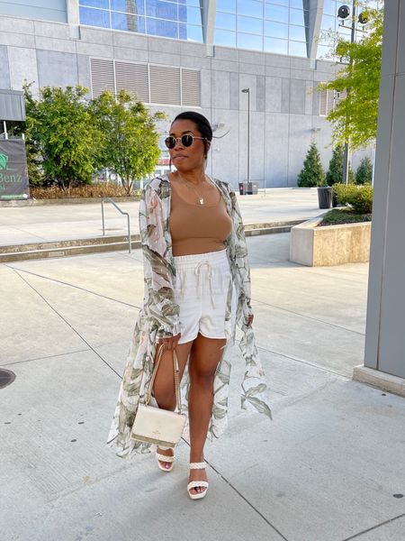 Get you a mom who knows how to take your photo. 📸

Linked my bodysuit, jewelry and shoes in the @shop.ltk app. My kimono I just picked up from @express outlet and can’t link it. 

||  #ltkseasonal #express #expresspartner #ltkitbag #ltkshoecrush #midtownatlanta #downtownatlanta #mercedesbenz #mercedesbenzstadium #atlantaga #coachoutlet