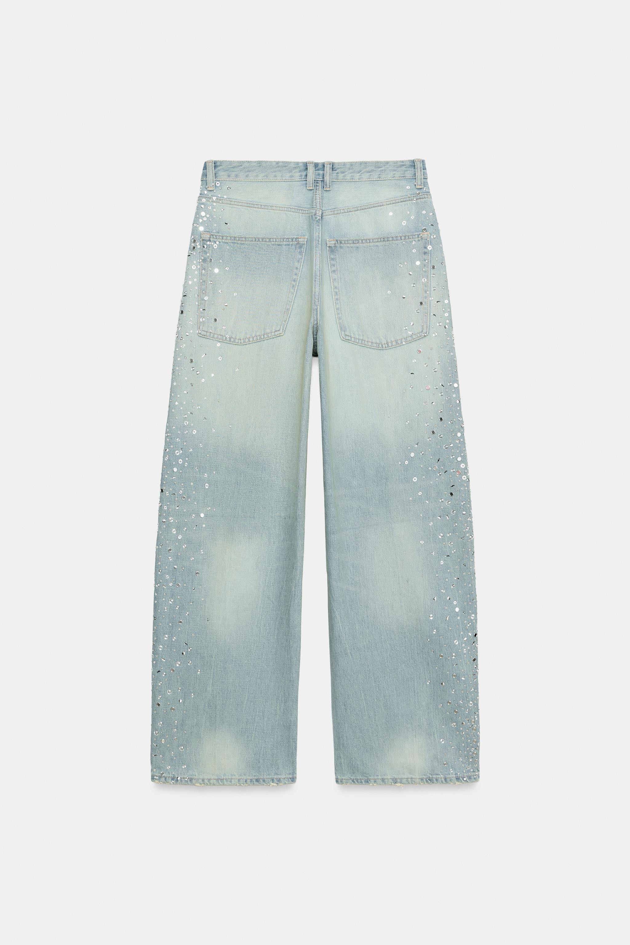Mid-rise jeans with belt loops and five pockets. Wide-leg cut. Features rhinestone embellishments... | Zara US