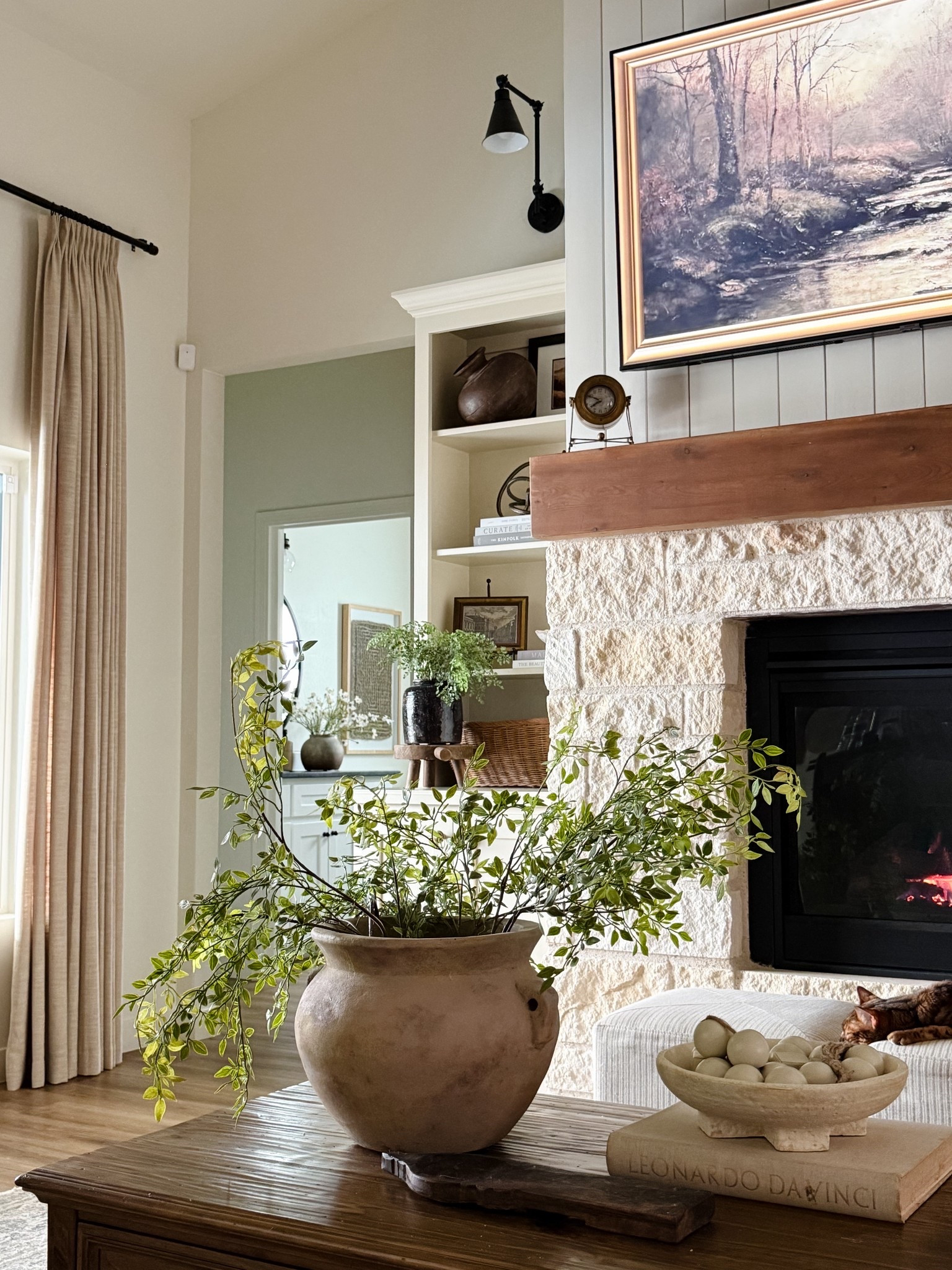 these realistic faux greenery stems from Amazon come in a large bundle and fill a large vase so well! 

I cannot link the pot as it’s a DIY from an outdoor pot from Home Depot! 

#LTKHome