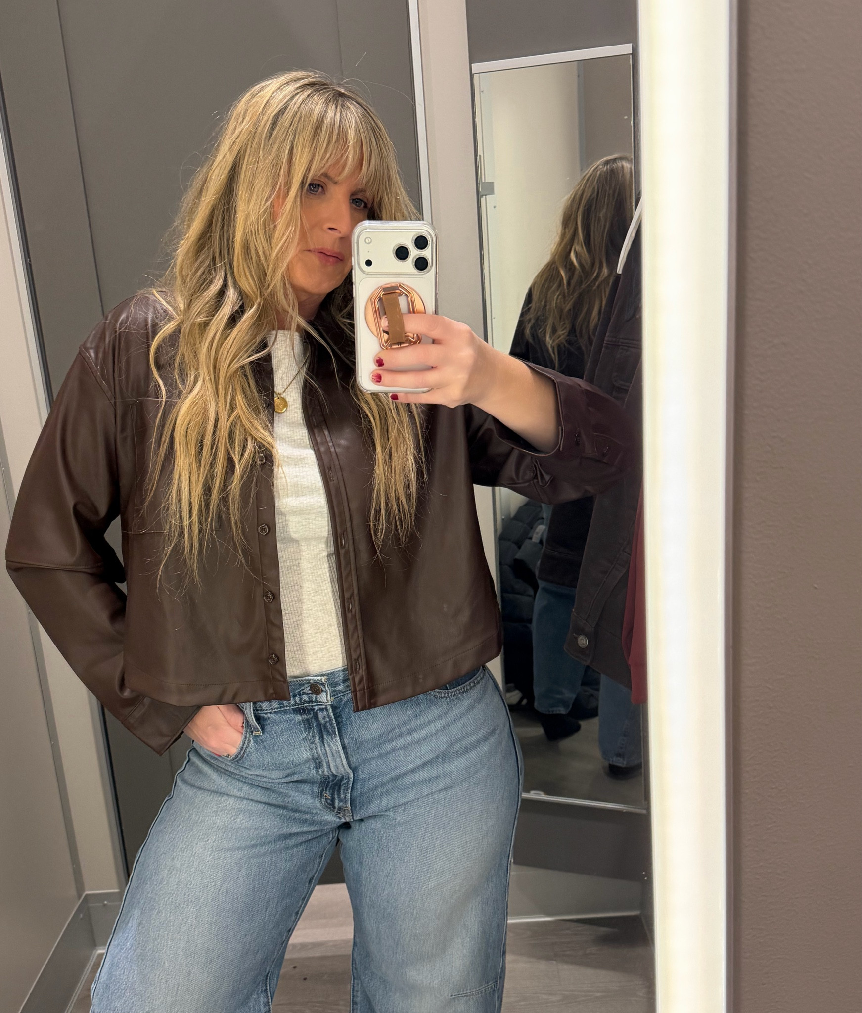 This Target faux leather button-down is such a standout—structured, stylish, and easy to layer or wear on its own. The color is so good 🤎

Styled with the Levi’s Cinch Waist barrel jeans for a relaxed but put-together look.

For reference, I’m 5’8”, typically a size 12, wearing a Large in the top and a 32 in the jeans.
I’d suggest sizing up in the jeans for a more comfortable fit.

#LTKFindsUnder100 #LTKFindsUnder50 #LTKMidsize